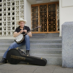 Man on steps with banjo
