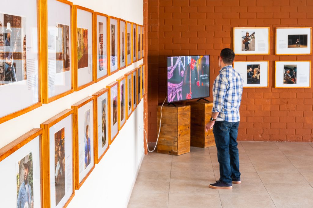 Man looking at television in gallery